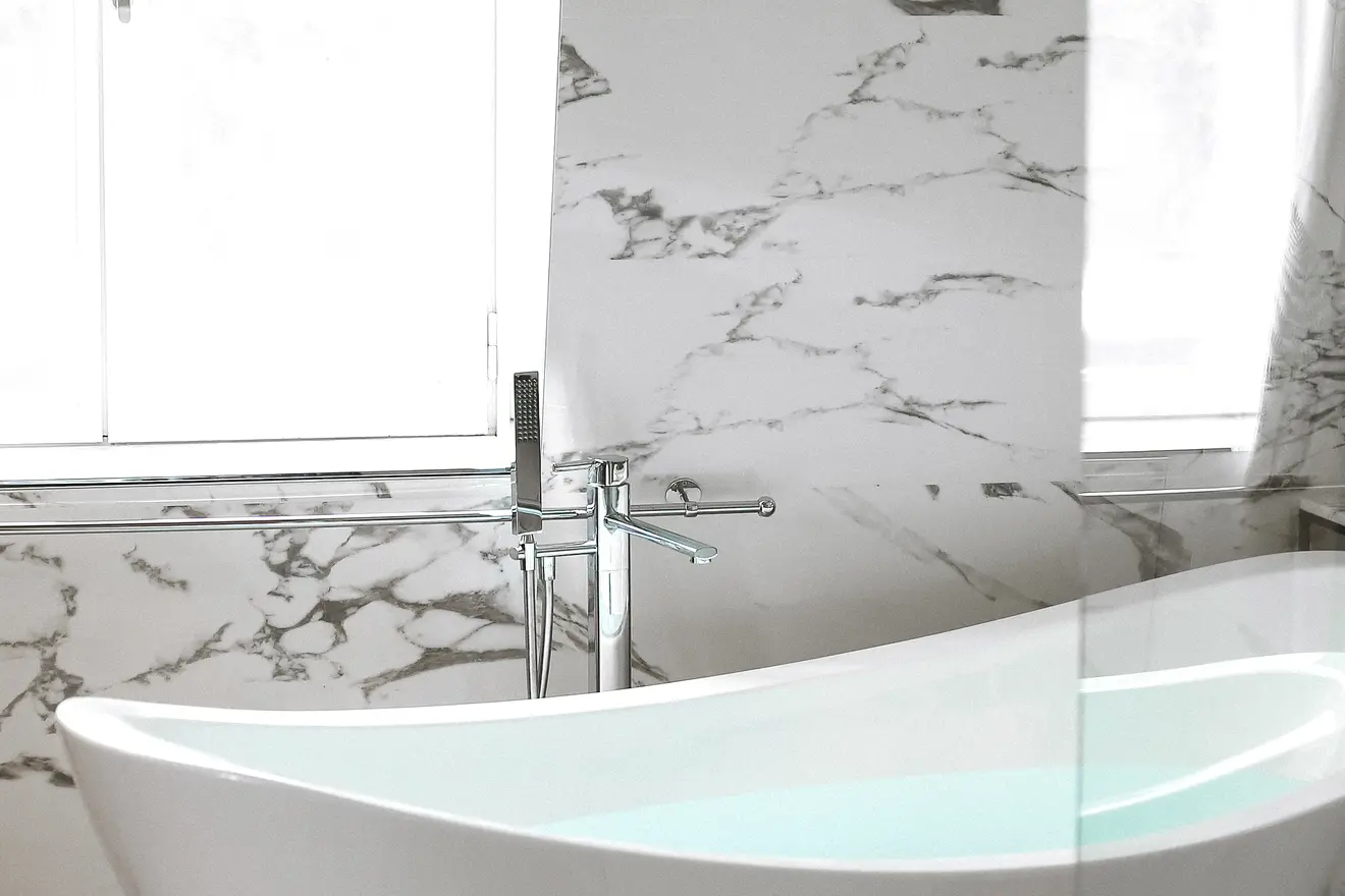 Freestanding bathtub with marble accents